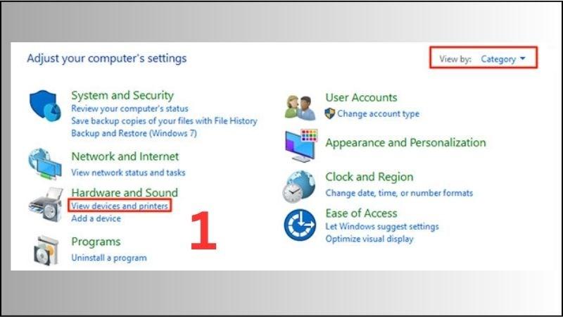 Vào mục Devices and Printers