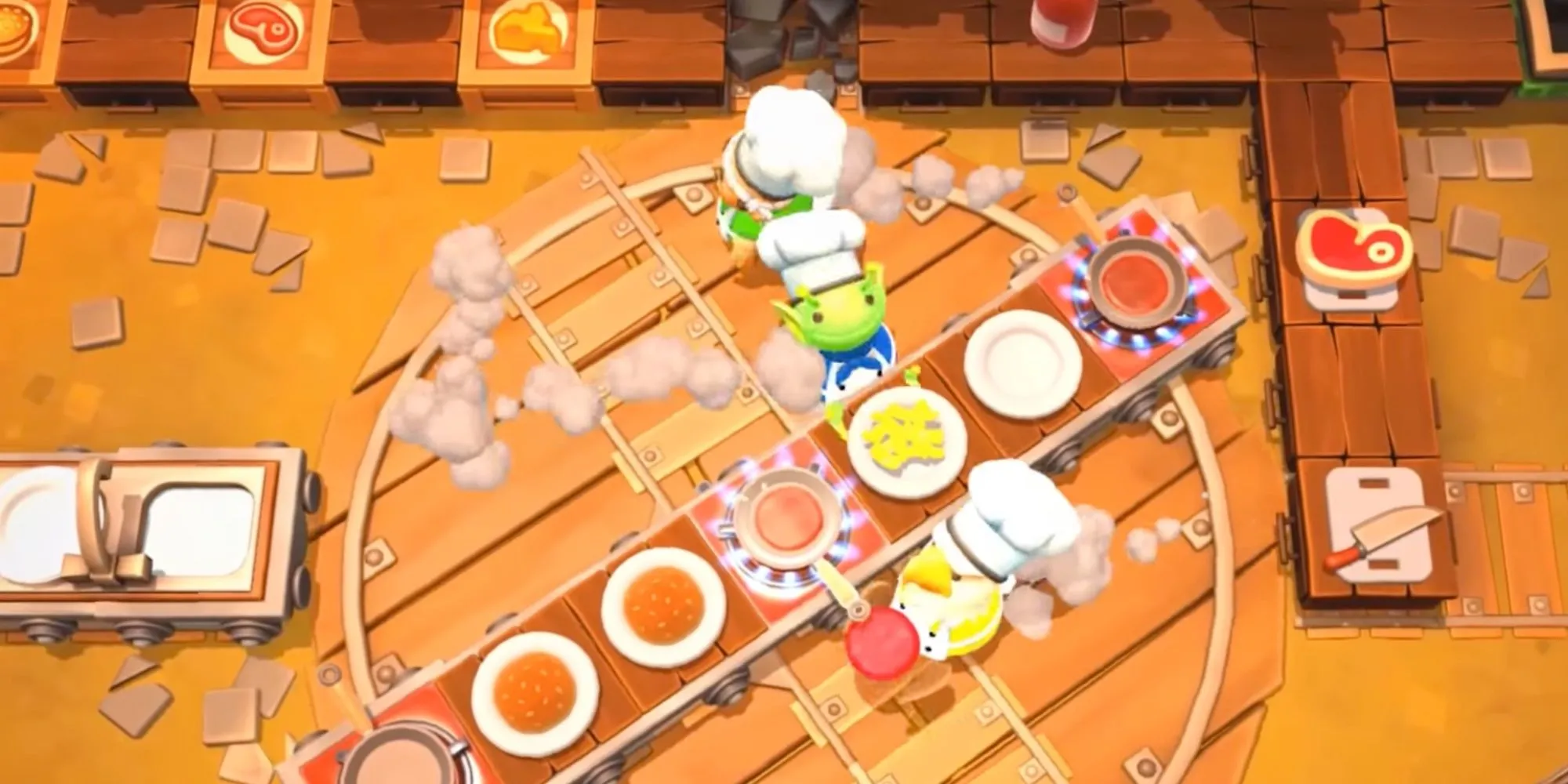 Ba người chơi trong Overcooked 2 đang cố gắng nấu ăn trên một bản đồ xoay tròn hỗn loạn