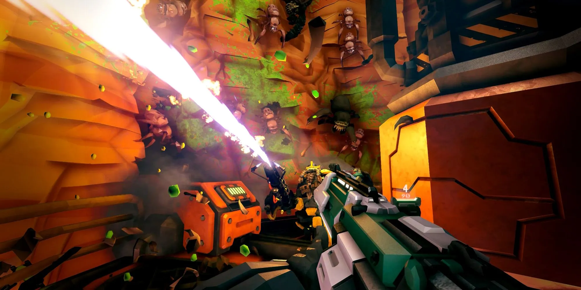 Bốn người lùn trong Deep Rock Galactic đứng trên mỏm đá nhìn xuống hang động đầy khoáng sản và kẻ thù