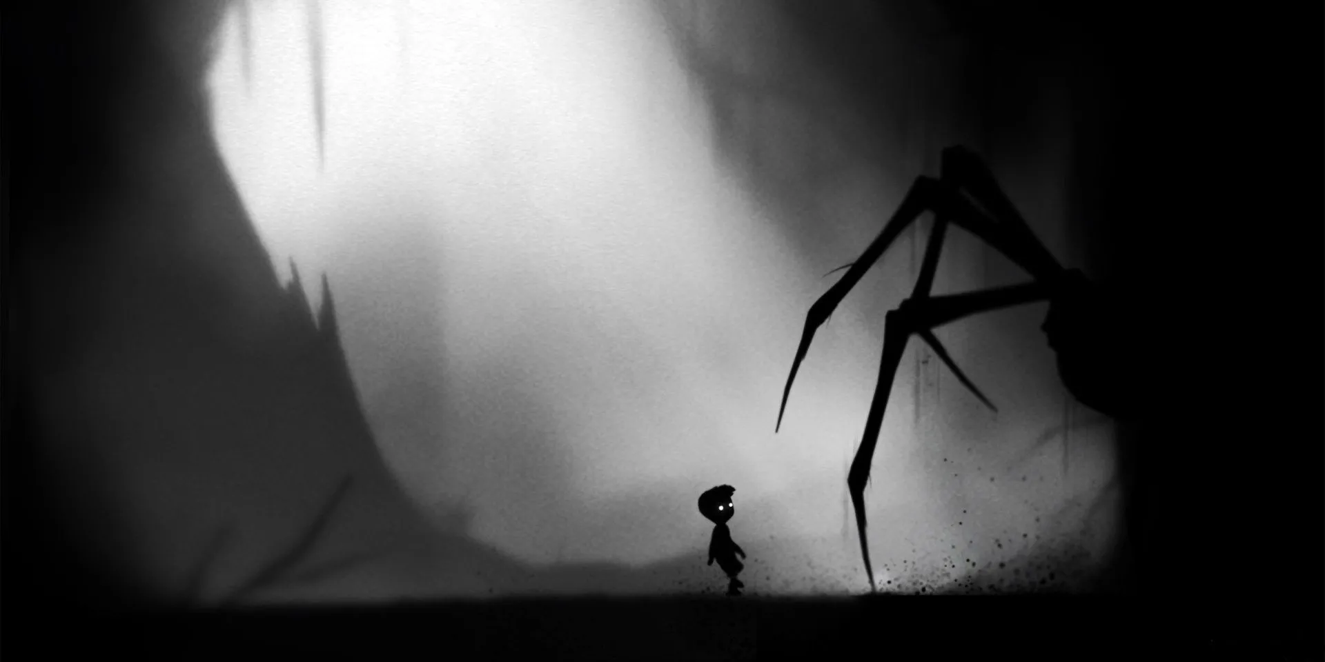 Cậu bé đối mặt với con nhện khổng lồ trong game Limbo