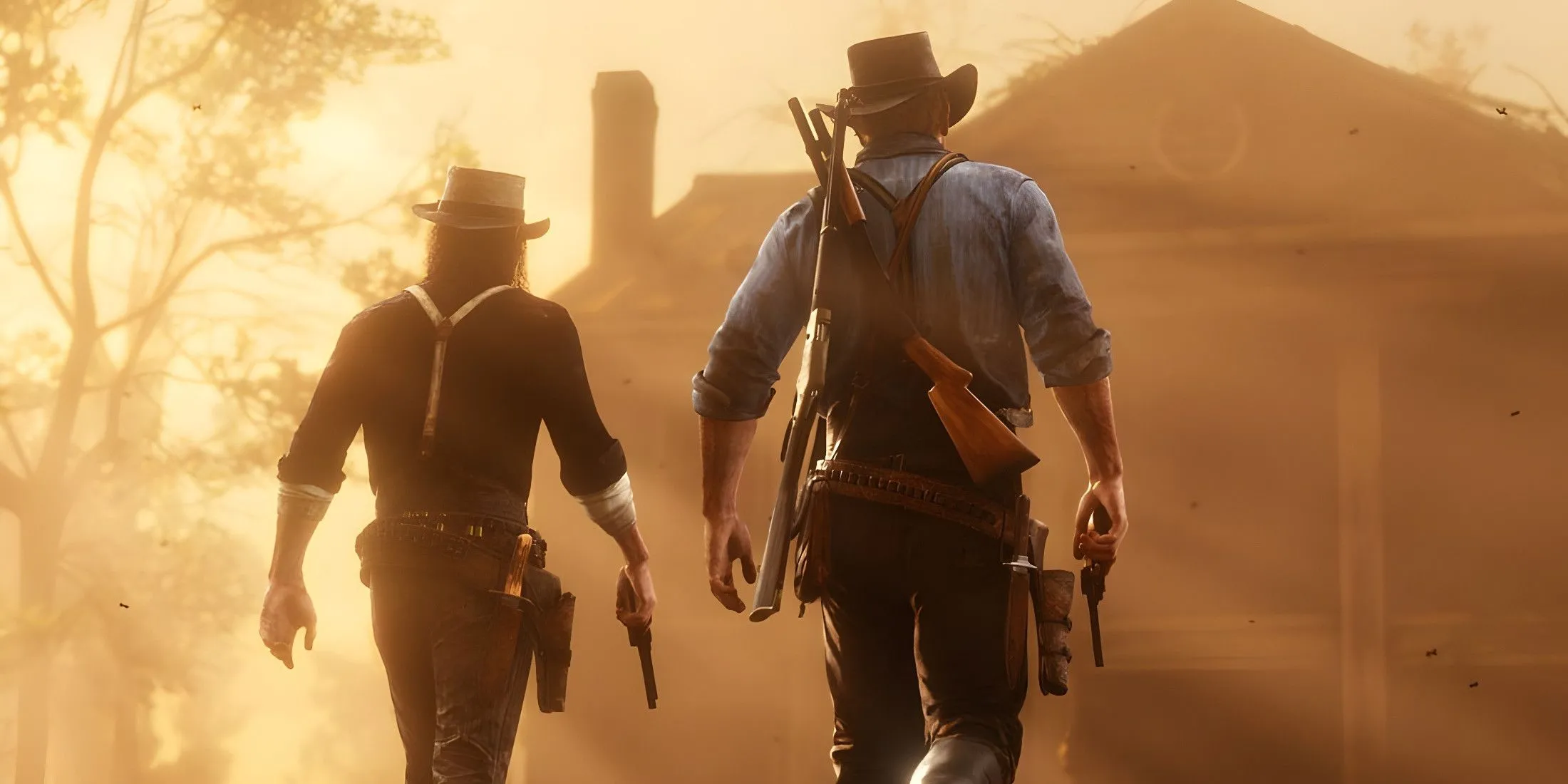 John Marston và Arthur Morgan đứng cạnh nhau trong một cảnh của Red Dead Redemption 2, thể hiện bối cảnh miền Tây hoang dã