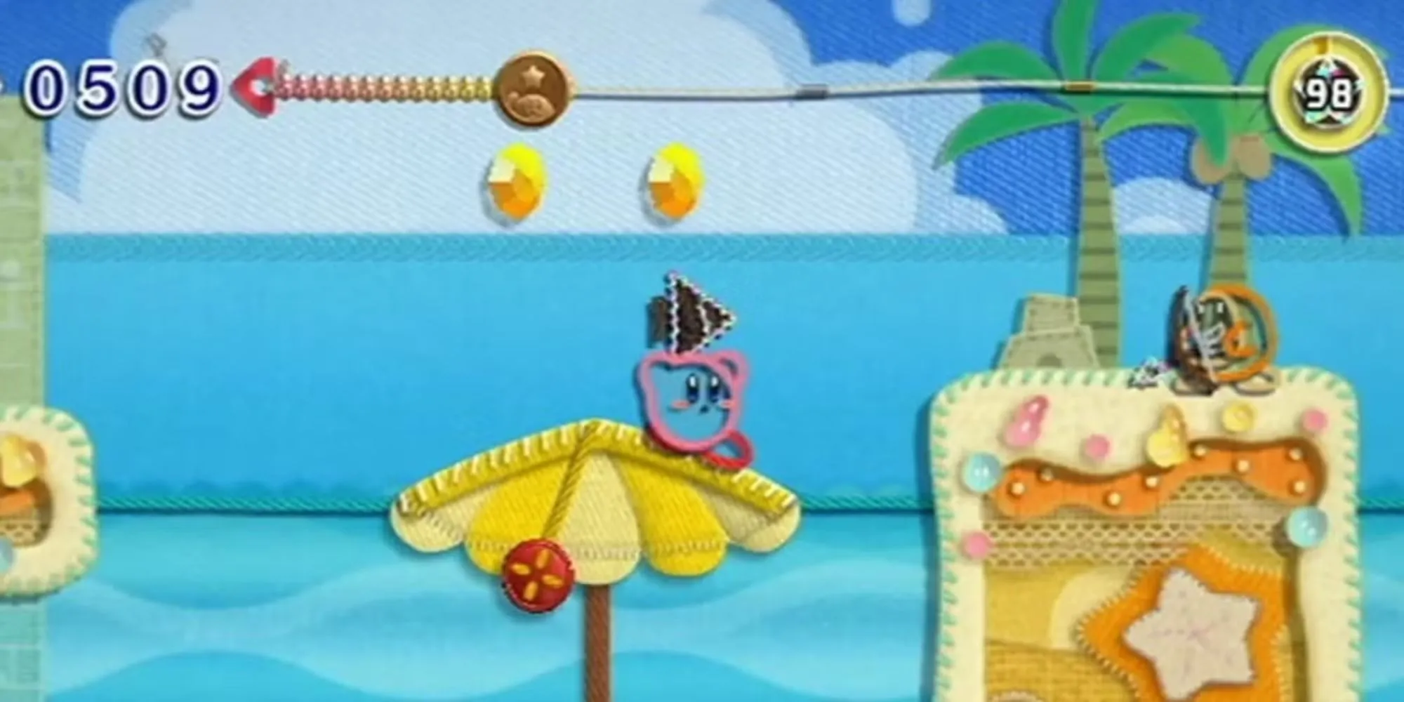 Kirby nhắm vào cung thủ Waddle Dee trong Kirby's Epic Yarn