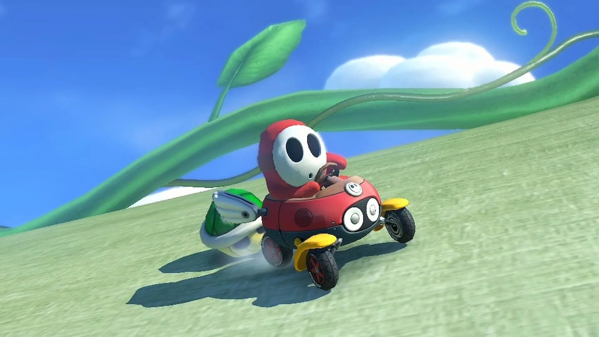 Shy Guy đỏ né mai rùa xanh trong Mario Kart 8 Deluxe trên Switch