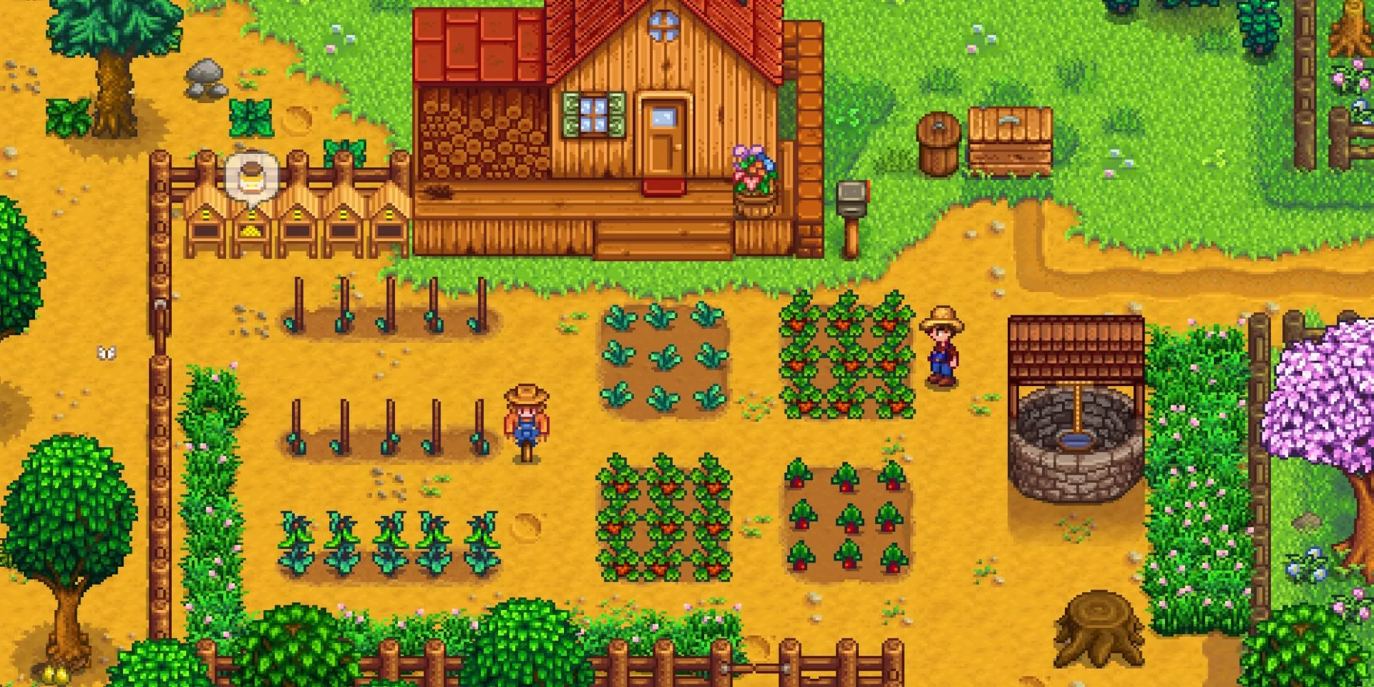 Trang trại của người chơi trong Stardew Valley với cây trồng, giếng nước, bù nhìn và tổ ong