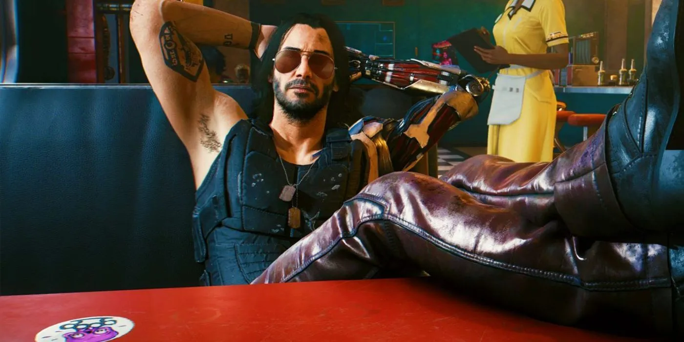 Johnny Silverhand ngồi gác chân trên bàn trong Cyberpunk 2077