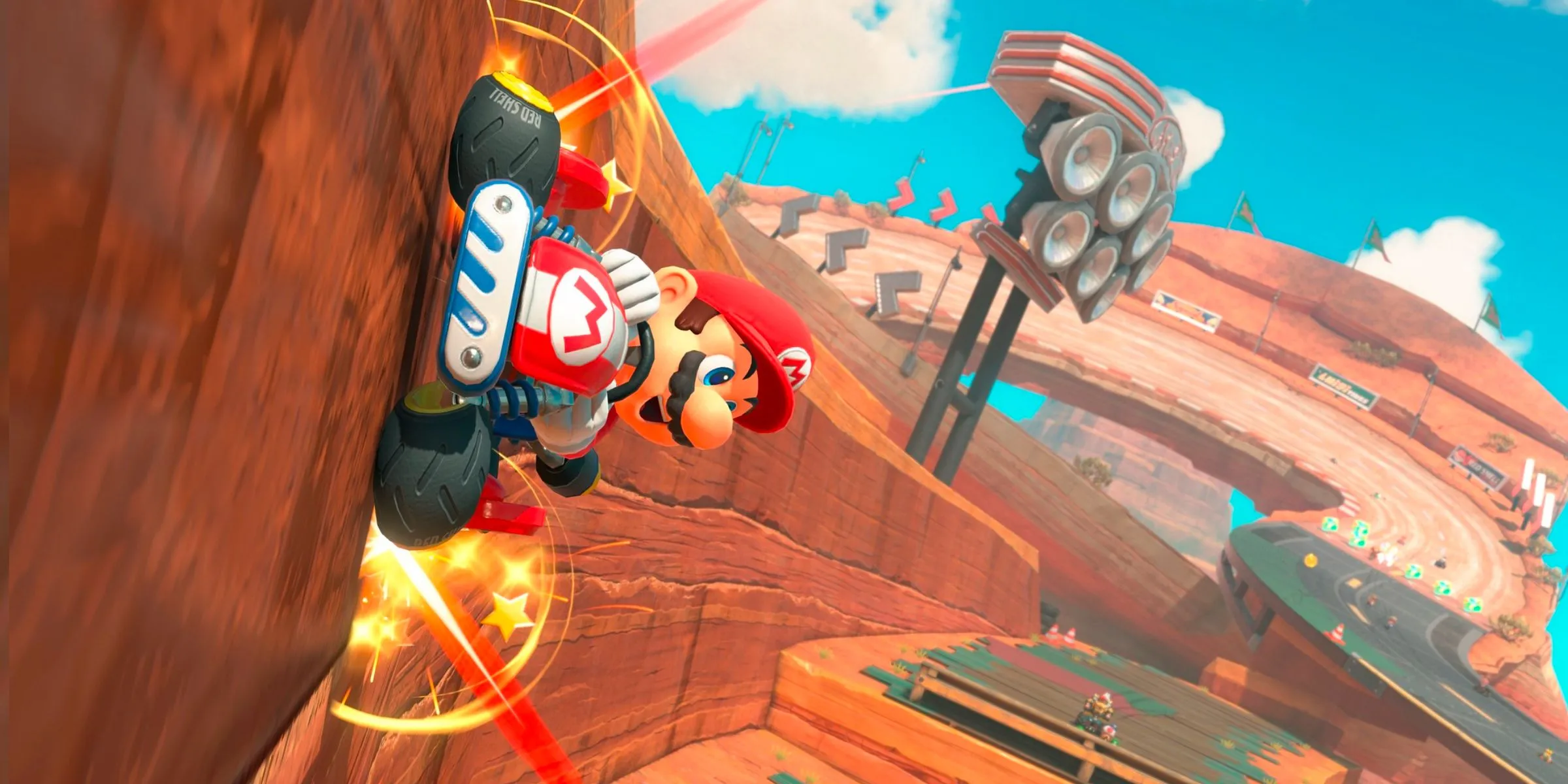 Mario lái xe trên tường trong đường đua Mario Bros Circuit, tận dụng môi trường trong Mario Kart World.