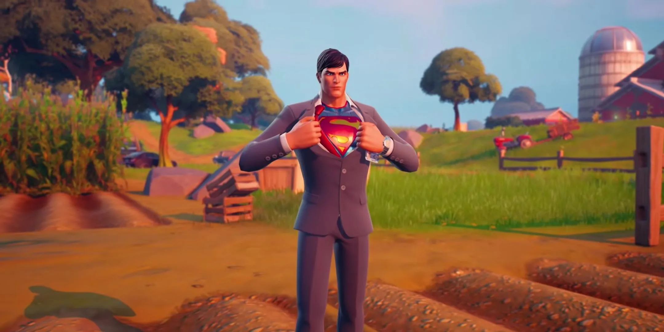 Mô tả: Nhân vật Clark Kent trong trang phục thường ngày đang thay đổi thành Superman trong game Fortnite, thể hiện tính năng thay đổi trang phục hoặc vật phẩm trang trí trong game.